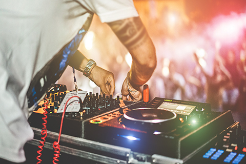 A stock photo of an up close view of a DJ's turntables.